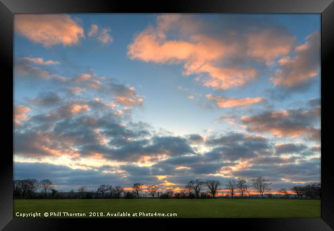 Sunset on a spring evening. Framed Print by Phill Thornton