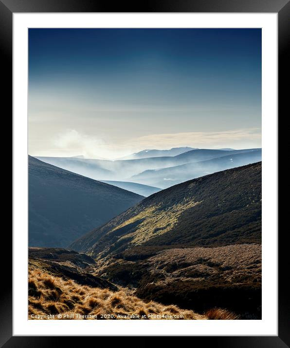 Misty mountains and valleys from the Snow Road Framed Mounted Print by Phill Thornton