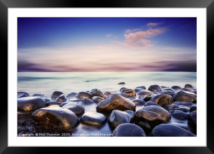 Dramatic skies as the sun sets over the North sea. Framed Mounted Print by Phill Thornton