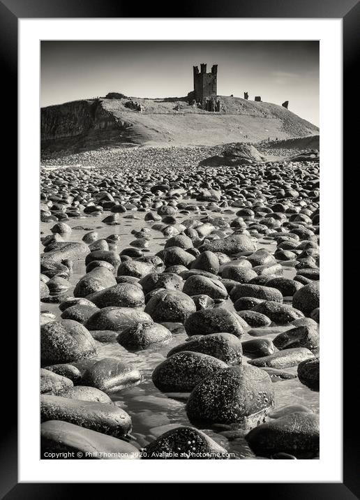 Dunsanburgh Castle and the North Sea. No. 2 B&W Framed Mounted Print by Phill Thornton