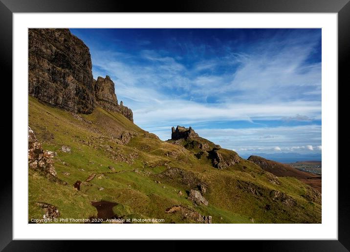 Blue skies over the Quiraing cliffs, Skye. Framed Mounted Print by Phill Thornton