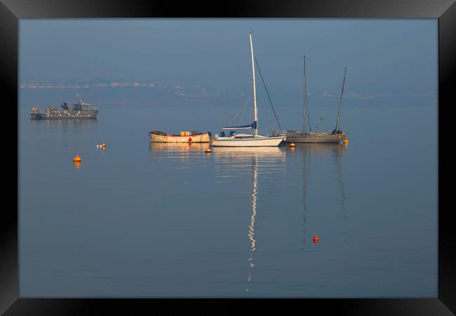 Boats moored in the harbour Framed Print by Steve Mantell