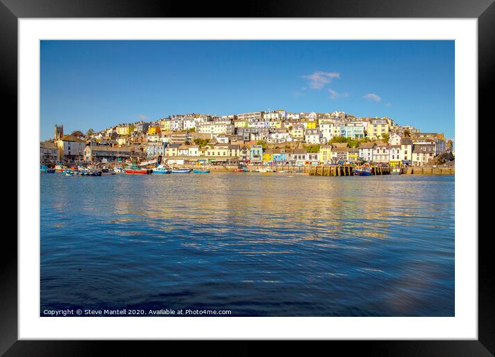 Brixham town houses in early morning sunshine Framed Mounted Print by Steve Mantell