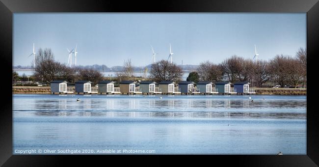 Osea Beach Huts Framed Print by Oliver Southgate