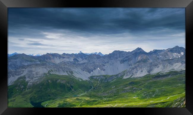 Clouds, mountains and pasture Framed Print by Rob Evans