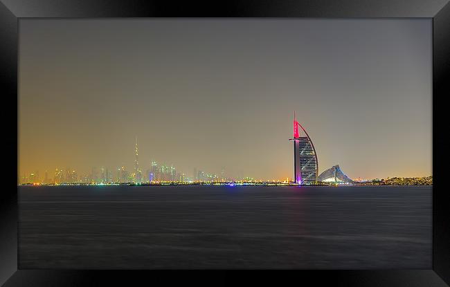 Dubai By Night Framed Print by Gary chadbond