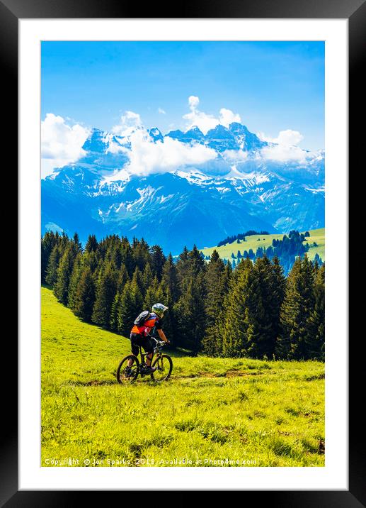 Mountain biker and Dents du Midi Framed Mounted Print by Jon Sparks