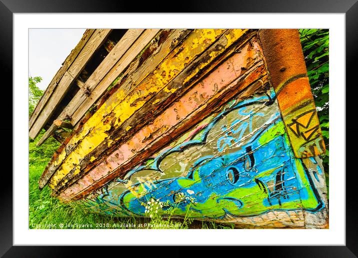 Graffiti on old boat Framed Mounted Print by Jon Sparks
