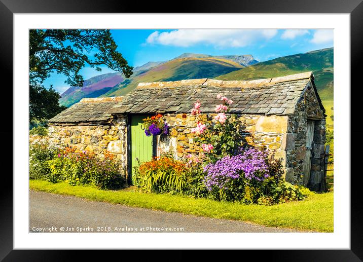 Flowers and stone hut with Blencathra behind Framed Mounted Print by Jon Sparks