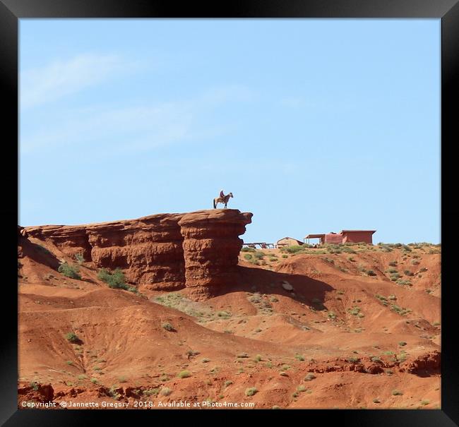 Lone cowboy in Monument Valley Framed Print by Jannette Gregory