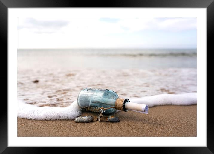 Message in a bottle in the surf Framed Mounted Print by Anthony Hart