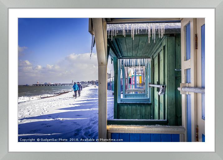 Icicles through the Beach Huts on a Winters day Framed Mounted Print by GadgetGaz Photo