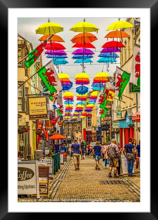 Umbrella Stroll in Caernarfon Framed Mounted Print by Ian Stone