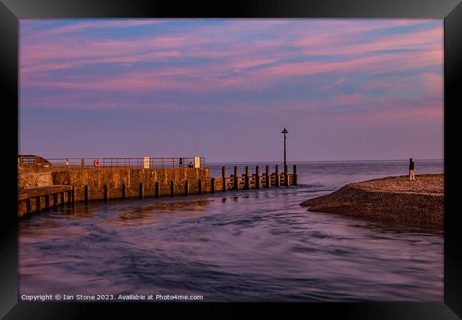 Watching the incoming tide. Framed Print by Ian Stone