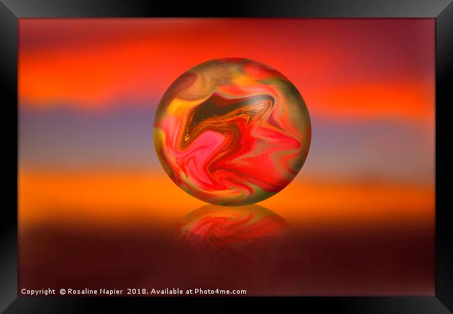 Glass globe on sunset background Framed Print by Rosaline Napier