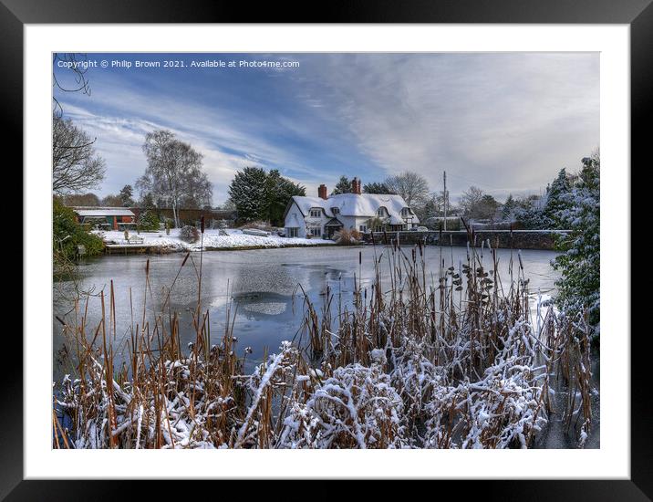 Village Pool, Badger with cottage in winters Snow Framed Mounted Print by Philip Brown
