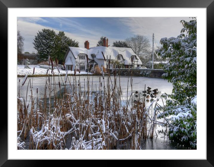 The old English cottage in winters Snow Framed Mounted Print by Philip Brown