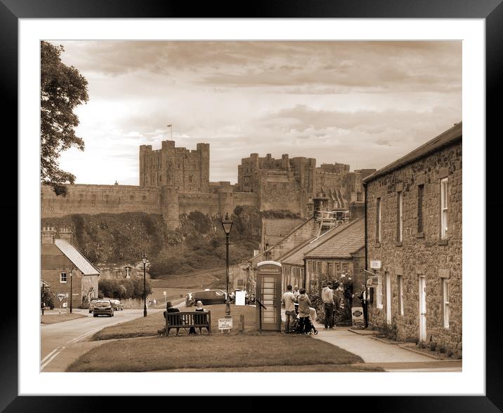 Bamburgh Village and Castle - Sepia Framed Mounted Print by Philip Brown