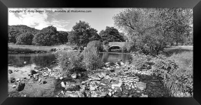 Welsh stream leading to an old bridge Framed Print by Philip Brown