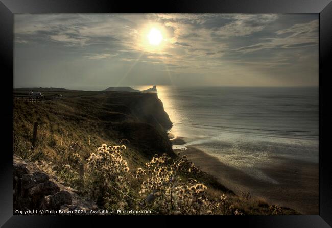 Sun setting across Worms Head, Rhosilli, The Gower Framed Print by Philip Brown