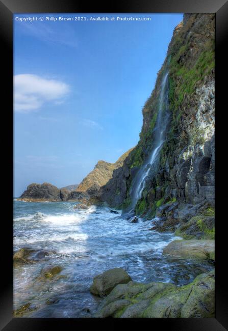 The Waterfall cascades into the sea at Tresaith, S Framed Print by Philip Brown