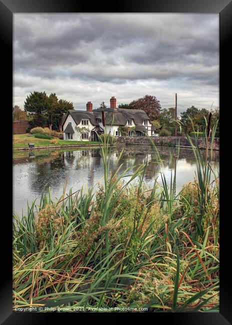 The Thatched Cottage by Pool Framed Print by Philip Brown