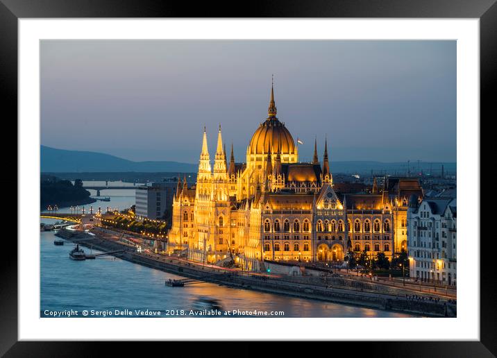 Parliament building at sunset in Budapest. Framed Mounted Print by Sergio Delle Vedove