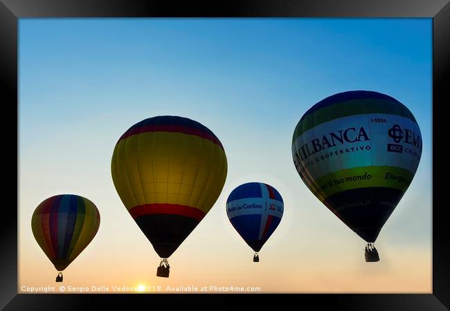 Balloons flying at the sunset Framed Print by Sergio Delle Vedove