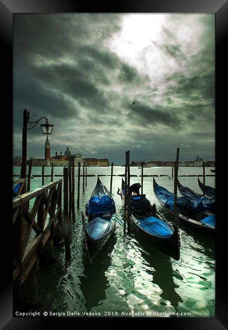 Gondolas on the lagoon in Venice Framed Print by Sergio Delle Vedove