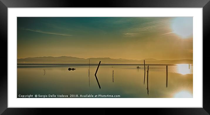 the sun reflected on the sea Framed Mounted Print by Sergio Delle Vedove