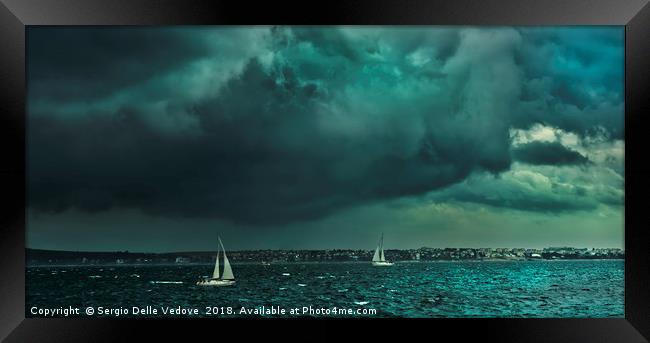 The thunderstorm on the sea Framed Print by Sergio Delle Vedove