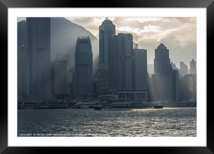 Victoria harbor in Hong Kong Framed Mounted Print by Sergio Delle Vedove