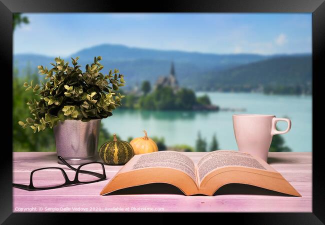 A book opened on the table Framed Print by Sergio Delle Vedove