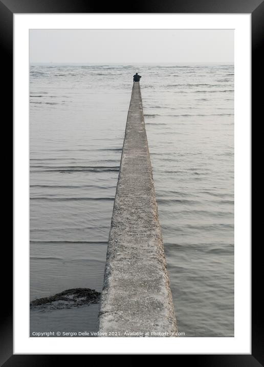 A man in front of the sea  Framed Mounted Print by Sergio Delle Vedove