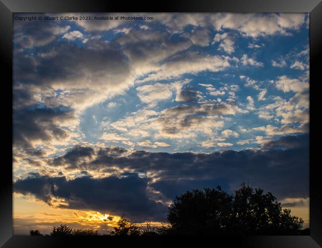 Cloudy sunset Framed Print by Stuart C Clarke