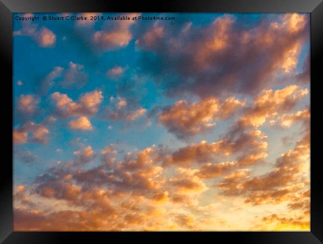 Cloudy sunset Framed Print by Stuart C Clarke