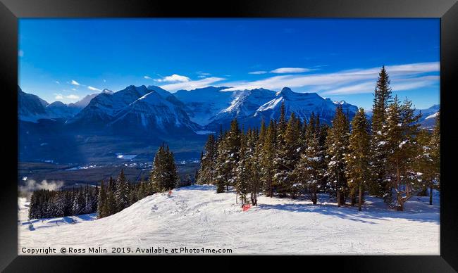 Skiing In Lake Louise Framed Print by Ross Malin