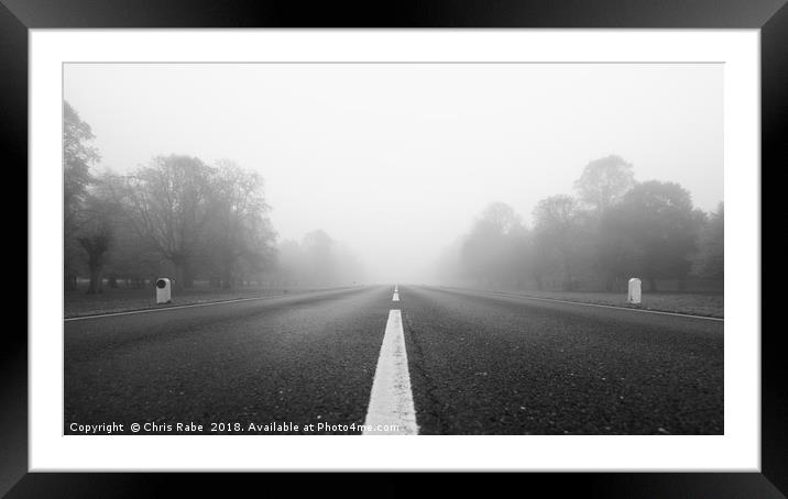 Low view down Foggy road  Framed Mounted Print by Chris Rabe