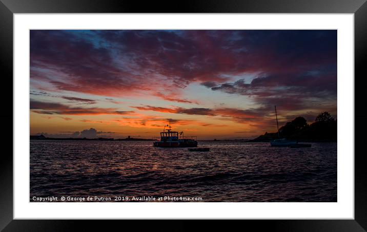 Sunset over a fishing boat in Guernsey Framed Mounted Print by George de Putron