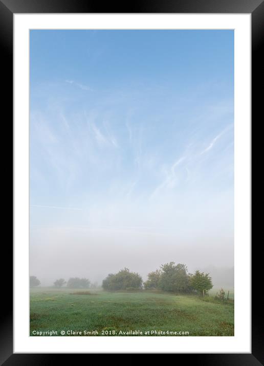 Whimsical foggy pasture and surprising blue sky Framed Mounted Print by Claire Smith