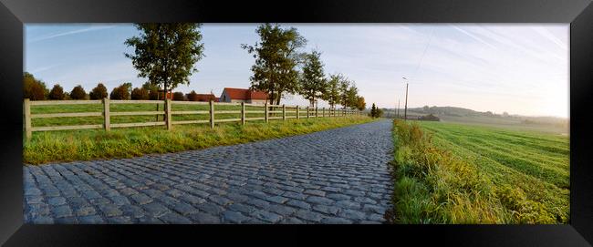 paving sett road  in autumnal sunlight Framed Print by youri Mahieu