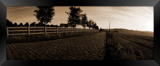 paving sett road in autumnal sunlight in sepia Framed Print by youri Mahieu