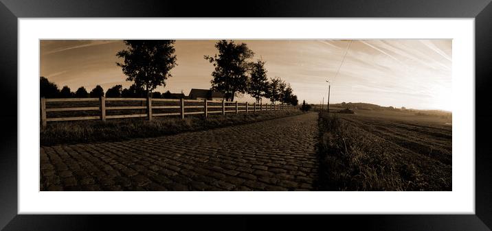 paving sett road in autumnal sunlight in sepia Framed Mounted Print by youri Mahieu