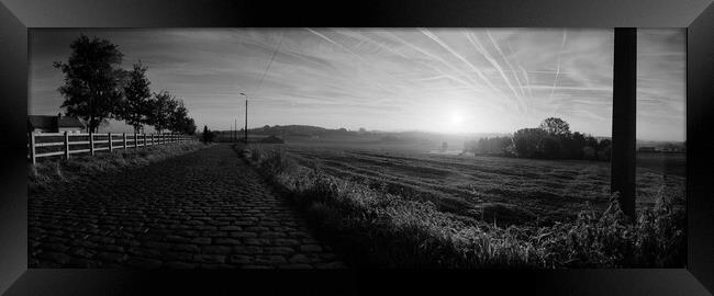 paving sett roadin autumnal sunlight in black and white Framed Print by youri Mahieu