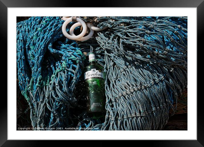 Abstract Gin bottle on fishing nets Framed Mounted Print by Tom McPherson