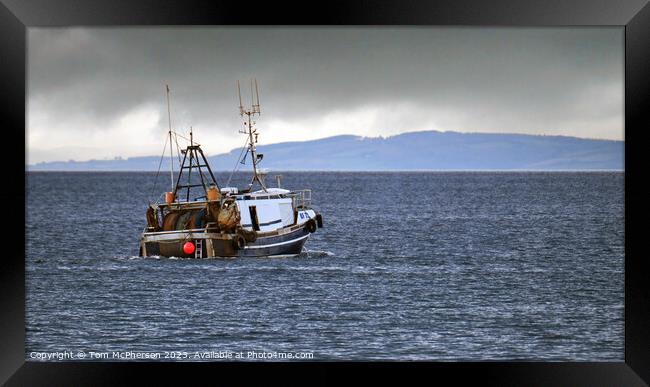 lone fishing boat on the Moray Firth Framed Print by Tom McPherson
