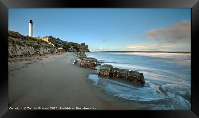 Lossiemouth lighthouse, with Covesea caves and beach below Framed Print by Tom McPherson