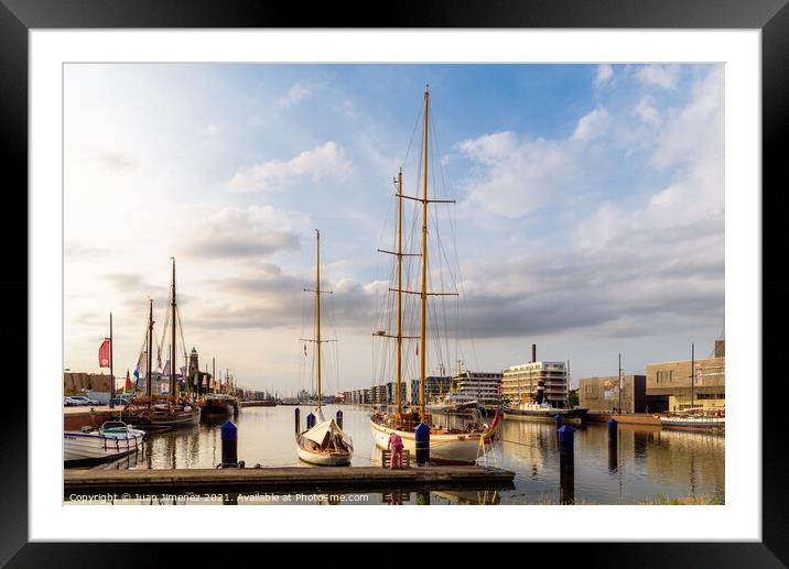 Scenic view of the port of Bremerhaven at sunset Framed Mounted Print by Juan Jimenez