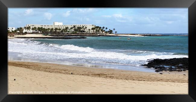 Lanzarote beach with hotel in the back ground  Framed Print by Holly Burgess