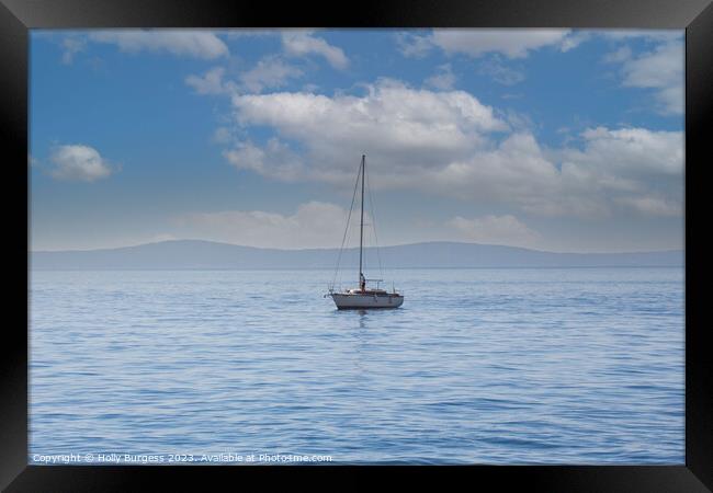 One lonely yacht on the carm sea of Split, a town in Crosia, mountions in the back ground  Framed Print by Holly Burgess